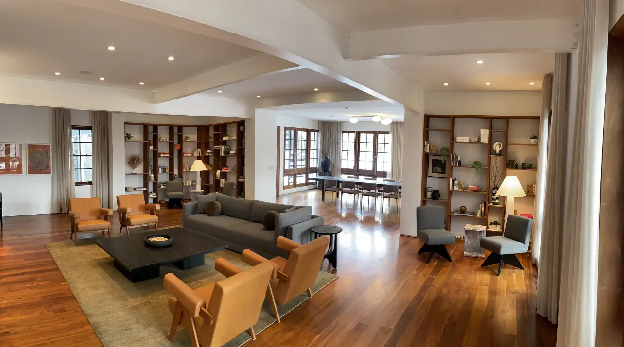 Open living and dining space with timber columns and wide-plank floors